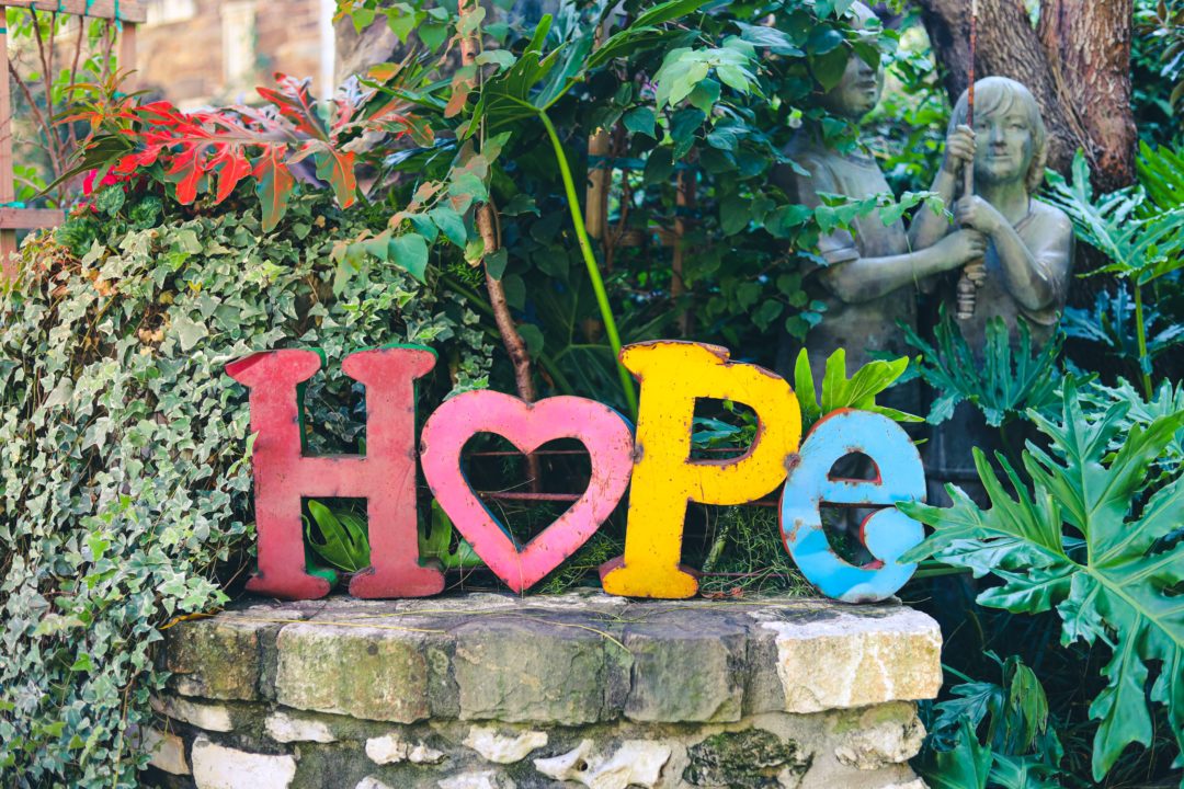 A picture of multicolored stones for the word "hope."